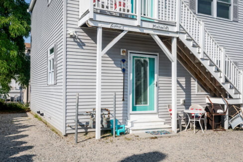 A house with stairs and a balcony.