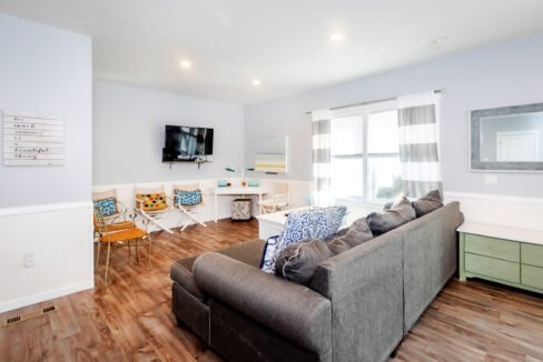 A living room with a couch and tv.