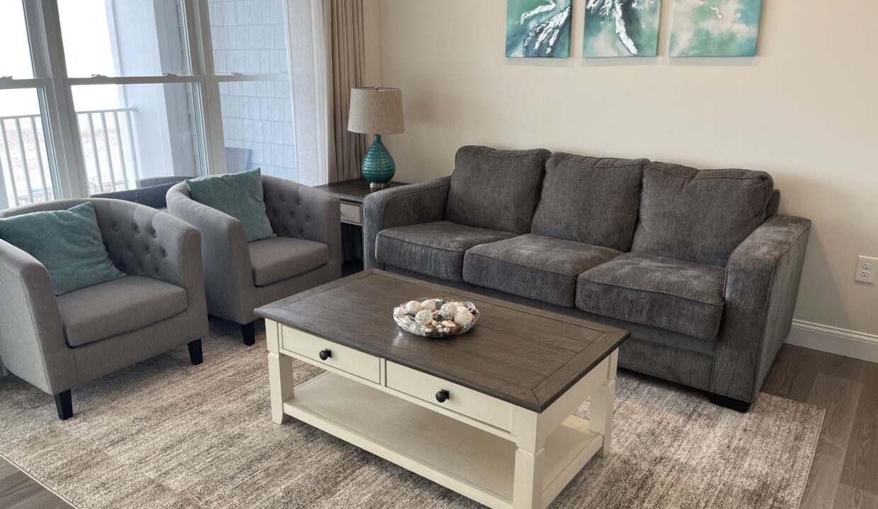 a living room with two couches and a coffee table.