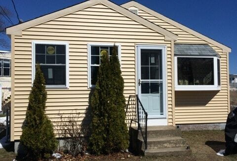 a house with a car parked in front of it.
