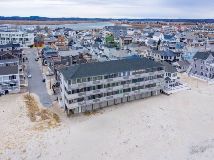 an aerial view of a beach front town.