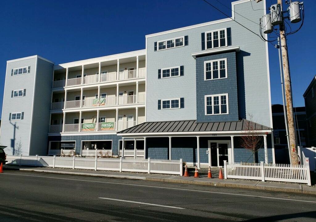 a blue and white building on the side of the road.