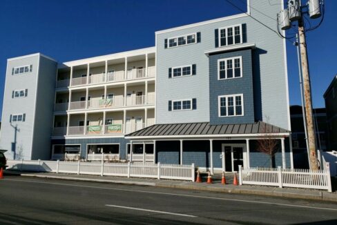 a blue and white building on the side of the road.