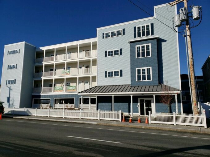 a blue and white building on the side of the road.