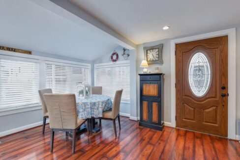 a dining room with a table and chairs.