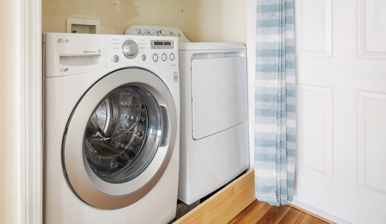 a washer and dryer in a small room.