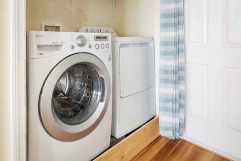 a washer and dryer in a small room.