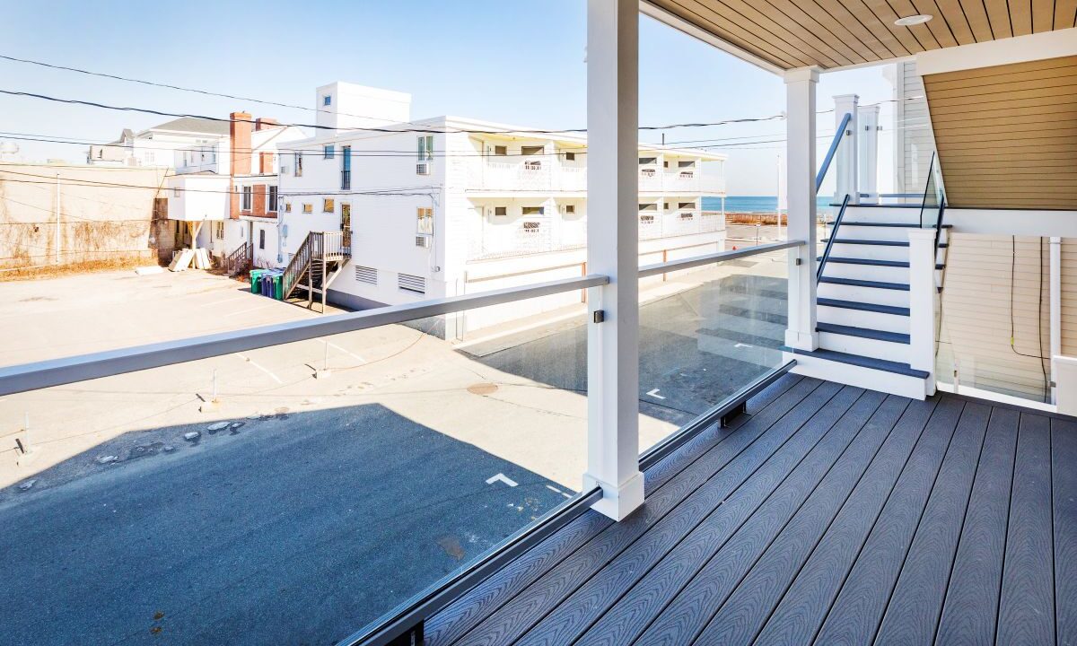 a balcony with a view of the ocean.