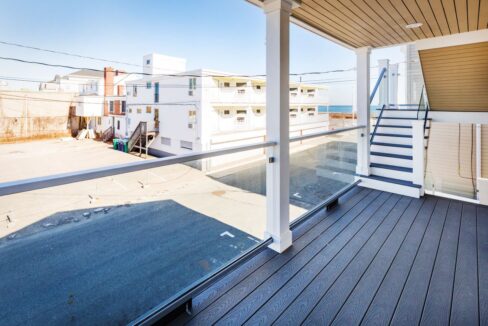 a balcony with a view of the ocean.