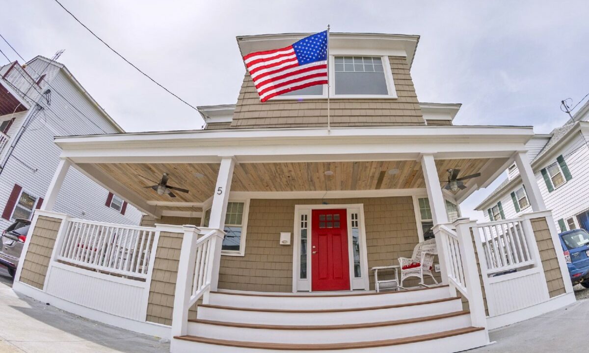 a house with a flag on the front porch.