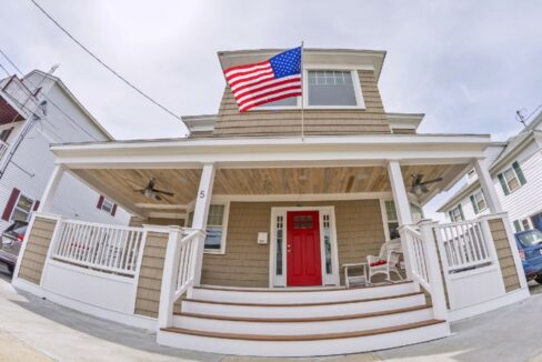 a house with a flag on the front porch.