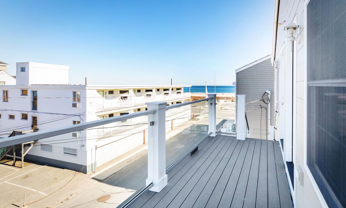 a balcony with a view of the ocean.