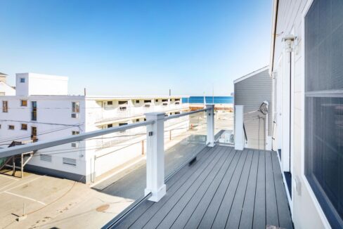 a balcony with a view of the ocean.