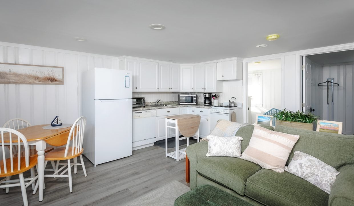 Bright, modern kitchen with an adjoining living area.