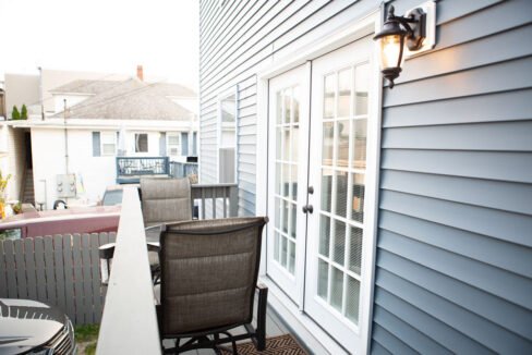 a patio with a table and chairs on it.