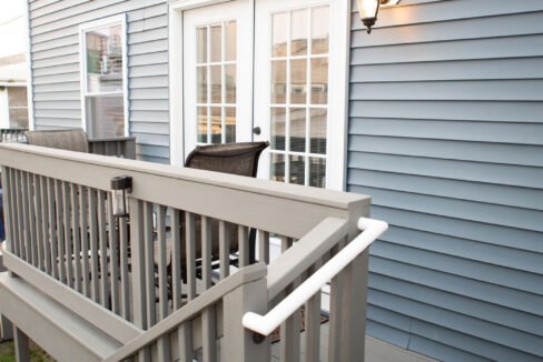 a house with a deck and a door.