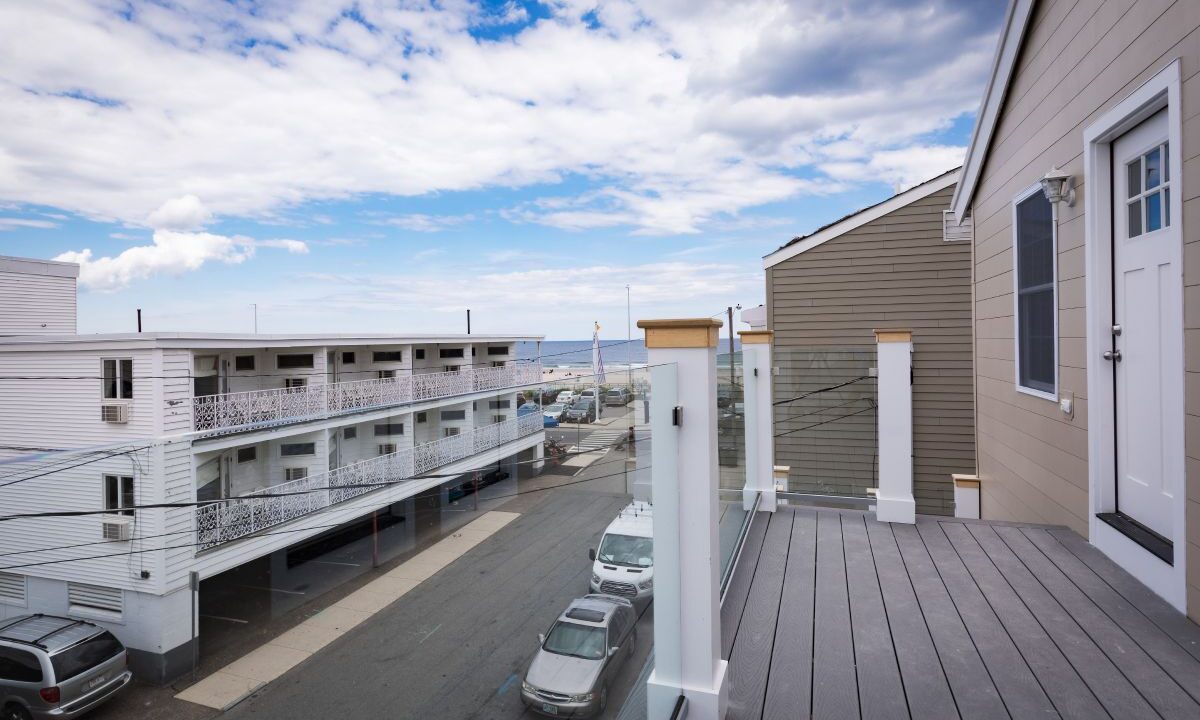 a view of a parking lot from a balcony.