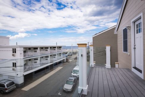 a view of a parking lot from a balcony.