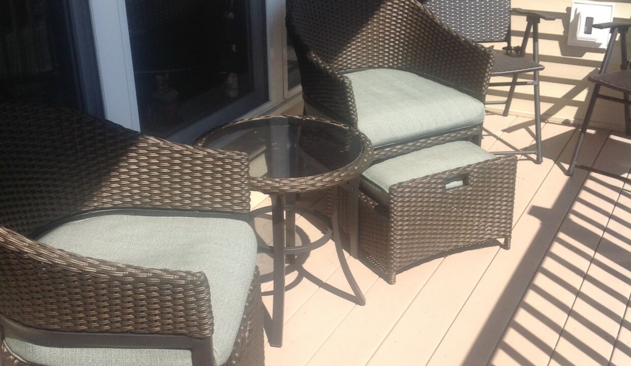 a couple of chairs sitting on top of a wooden floor.