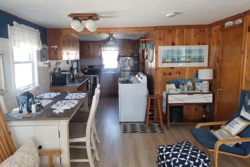A kitchen and dining area in a small cabin.