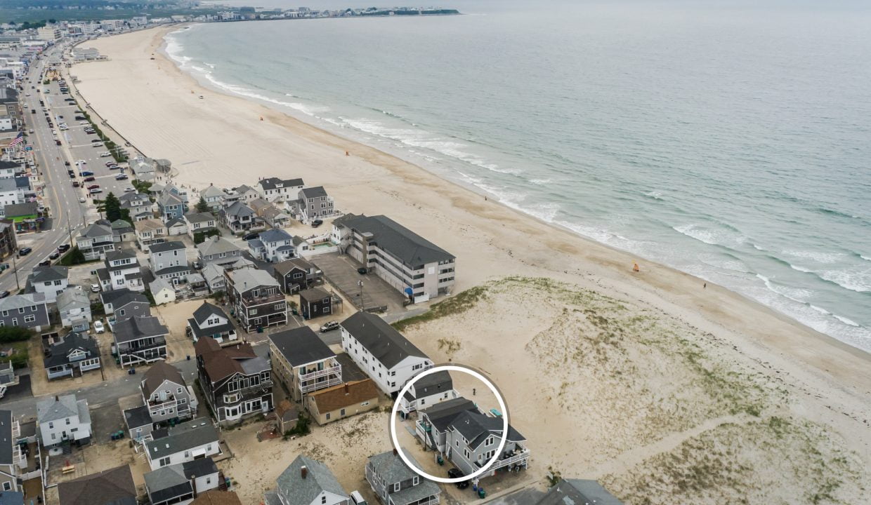 an aerial view of a beach and a city.