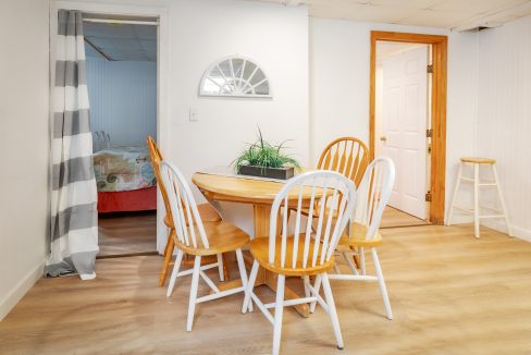 a dining room with a table and chairs.