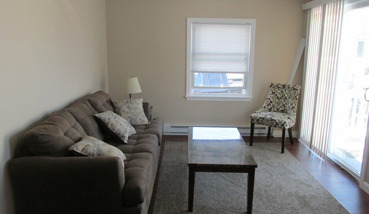 a living room with a couch and a coffee table.