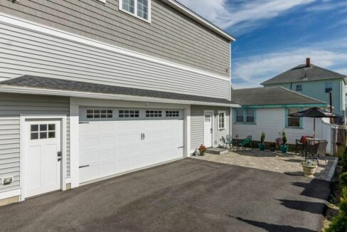 a house with a large driveway and a garage.