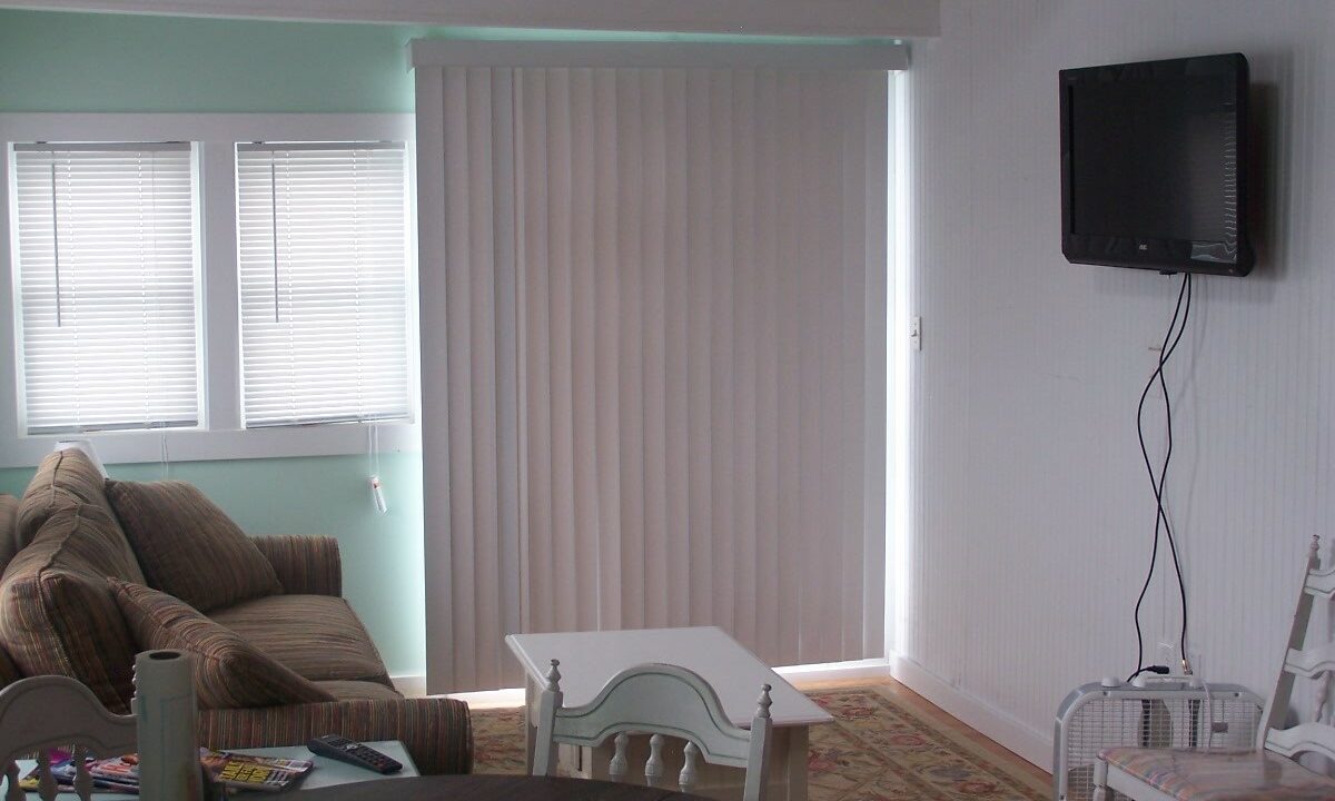 a living room filled with furniture and a flat screen tv.