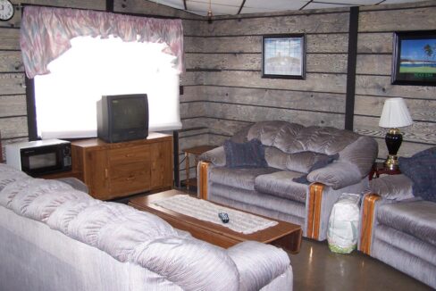 a living room filled with furniture and a flat screen tv.