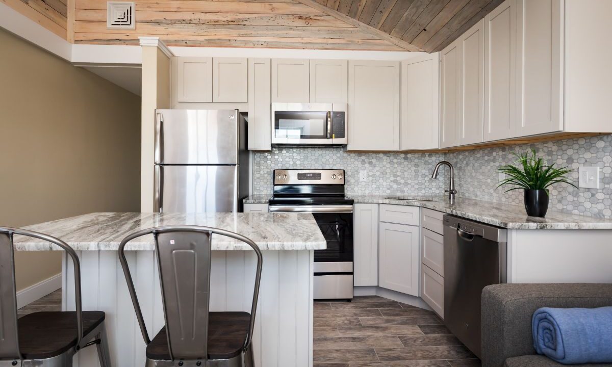 a kitchen with a couch and a table in it.