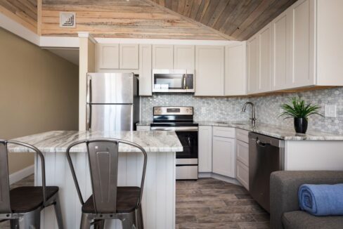 a kitchen with a couch and a table in it.