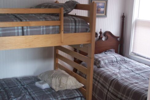 a couple of bunk beds sitting next to each other.