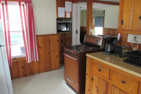 a kitchen with a stove and a refrigerator.
