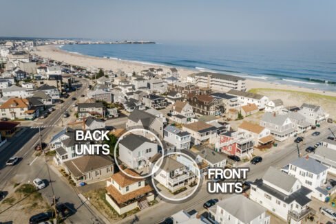 An aerial view of a neighborhood with houses and a beach.
