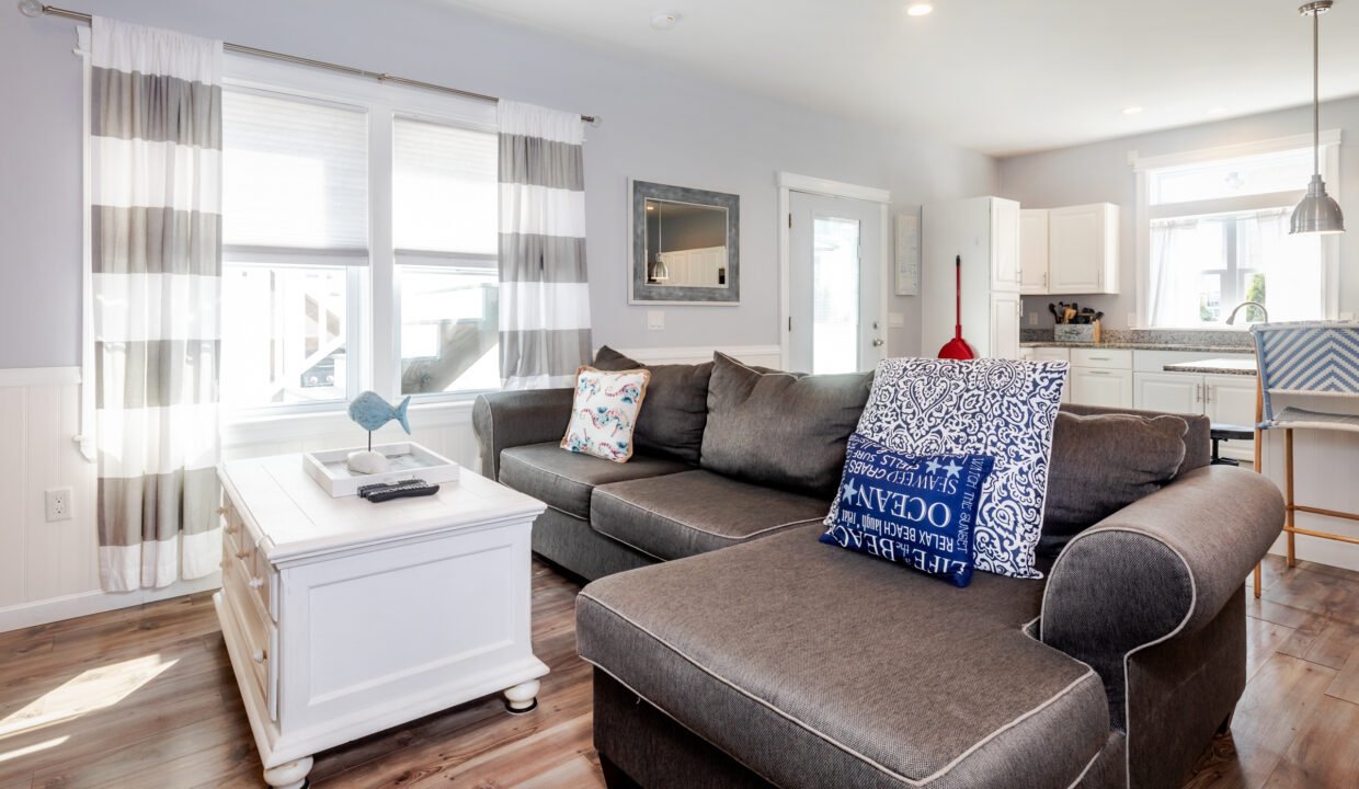 A living room with a couch and a coffee table.