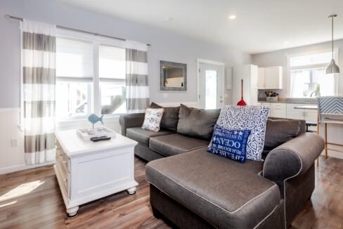 A living room with a couch and a coffee table.