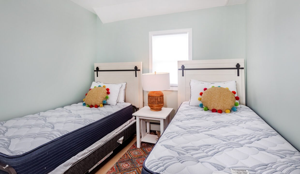 Two twin beds in a small room.