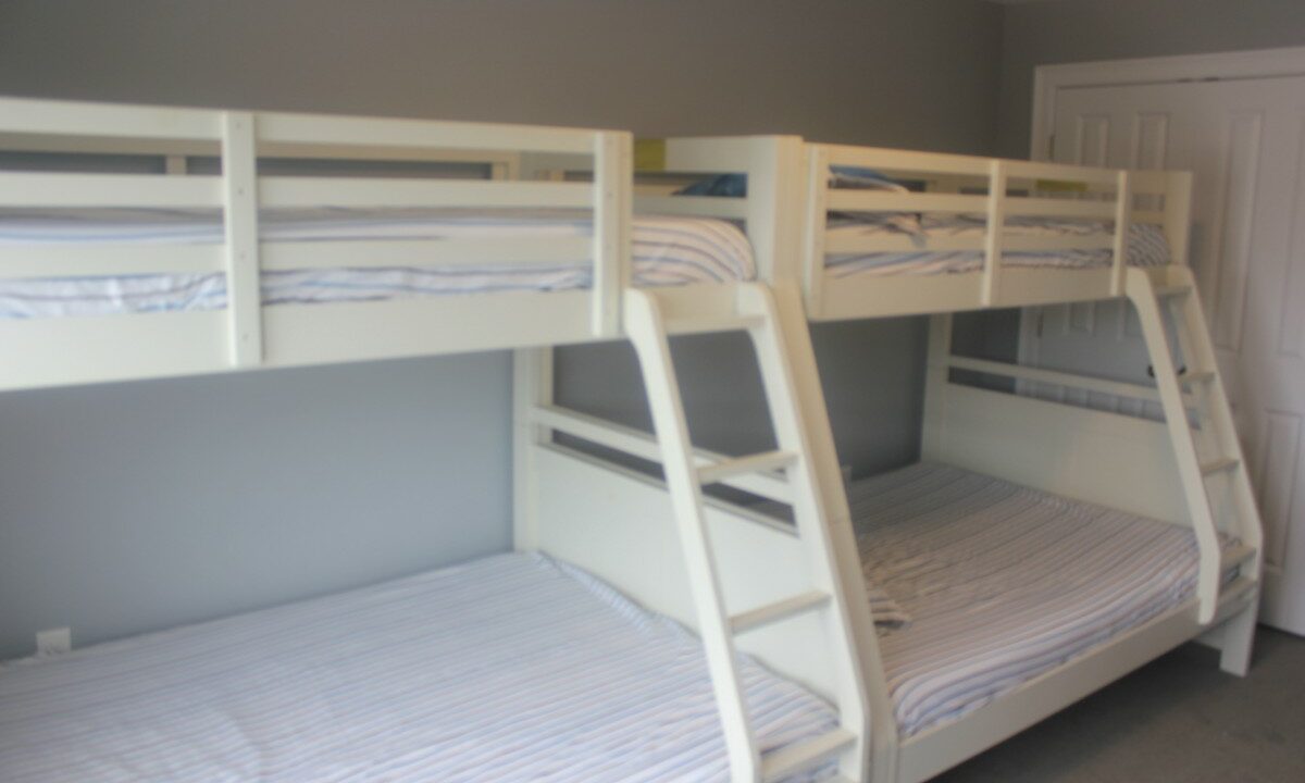 a couple of bunk beds sitting next to each other.