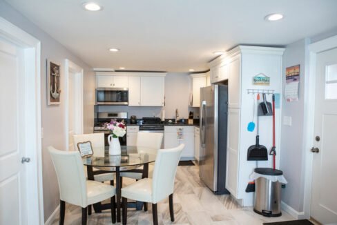 a kitchen with a table and chairs in it.