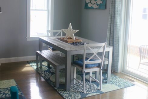 a dining room with a table and chairs.