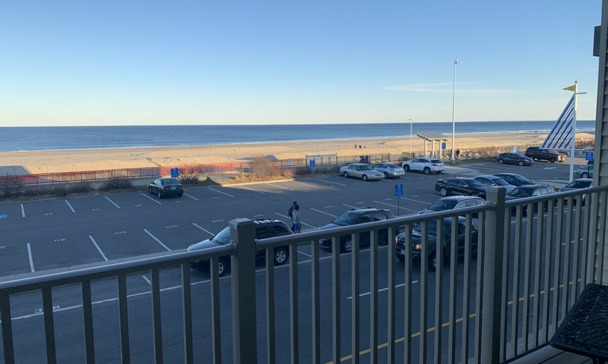 a view of a parking lot from a balcony.