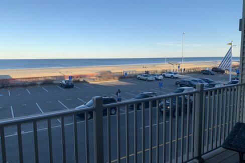 a view of a parking lot from a balcony.