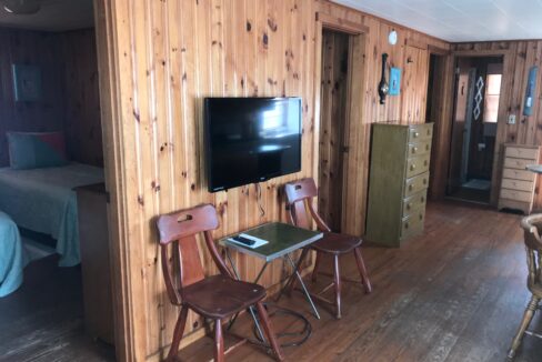 a room with wooden walls and a flat screen tv.