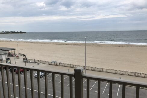 a view of the beach from a balcony.