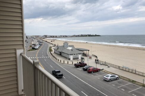 a view of a beach from a balcony.