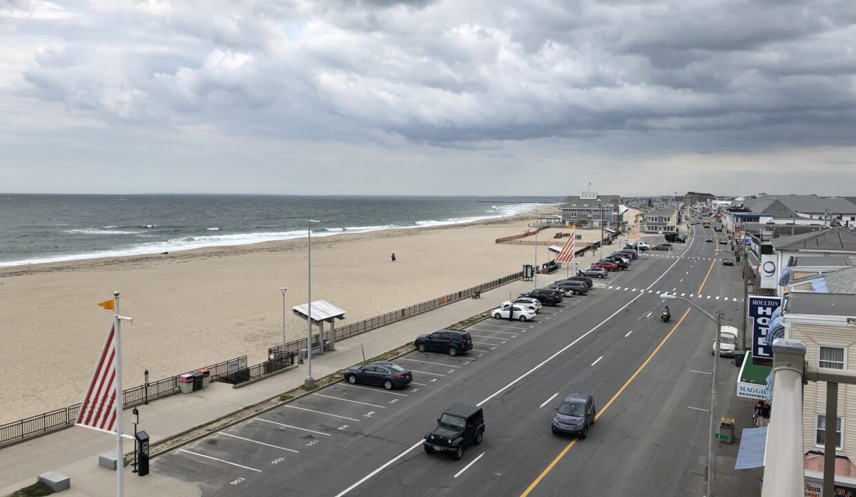 a view of a beach from a balcony of a hotel.