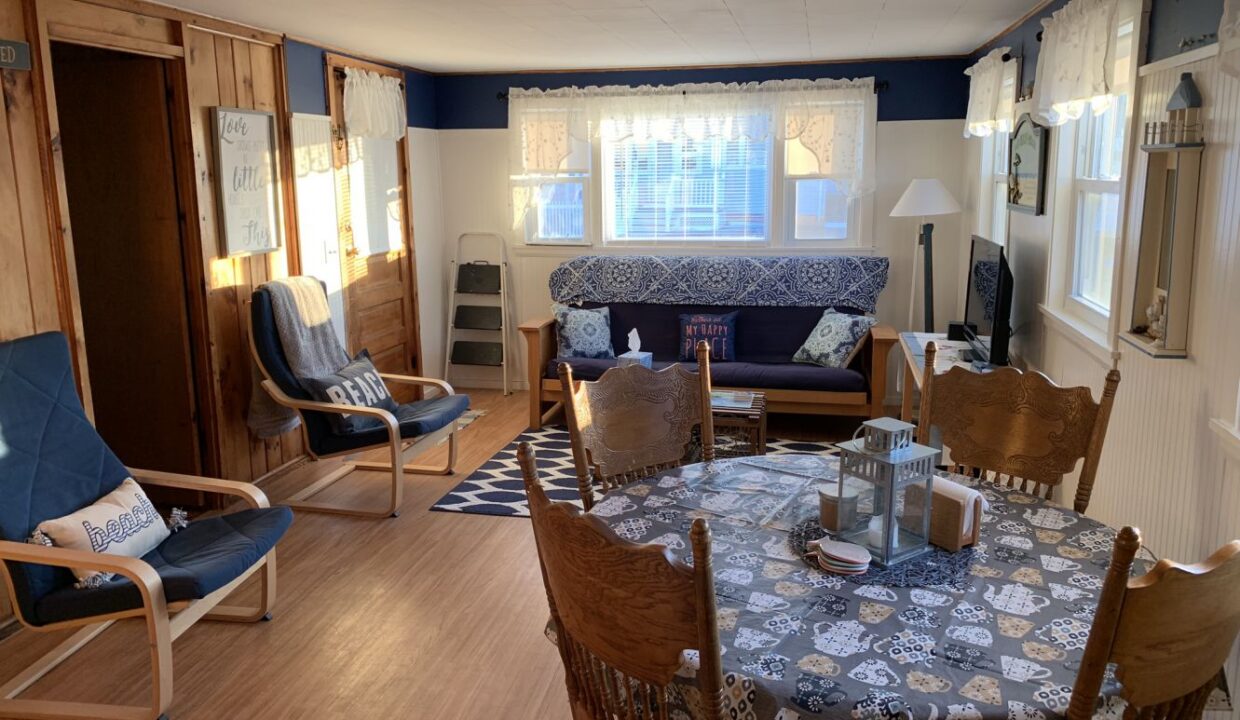 a living room filled with furniture and a fire place.