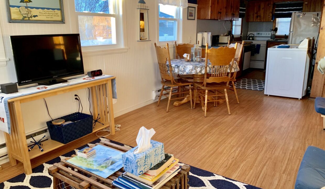a living room filled with furniture and a flat screen tv.