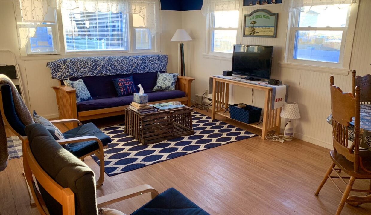 a living room filled with furniture and a flat screen tv.